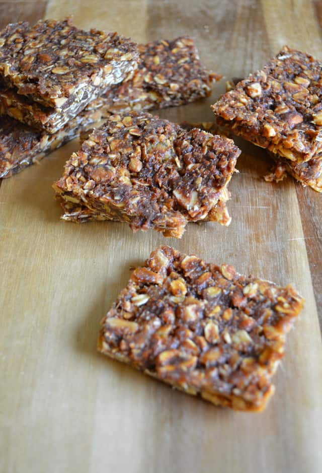 Oatmeal bars on a wood cutting board.