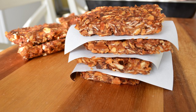 Energy Bars stacked on a wood cutting board.