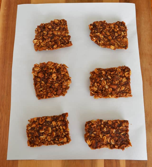 Square pieces of oatmeal, nut, and chocolate bars.