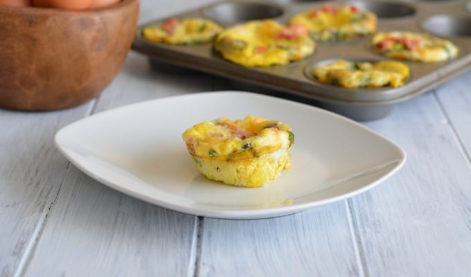 Roasted Pepper & Egg Breakfast Muffin on a white plate.