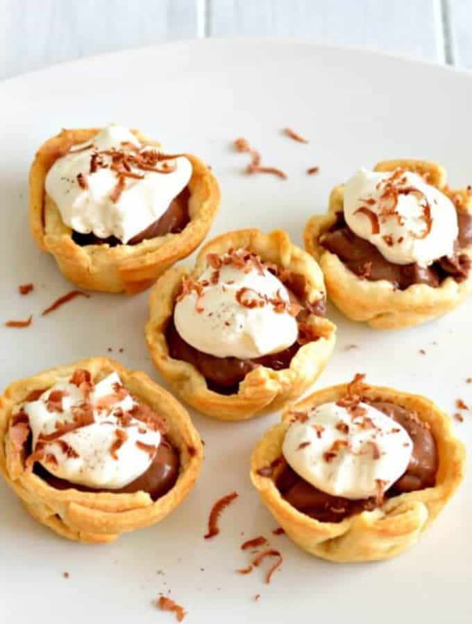 Mini pies on a white plate.