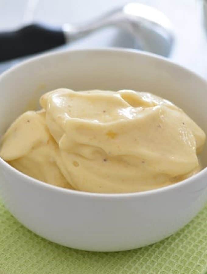 Frozen Banana ice cream in a white bowl.
