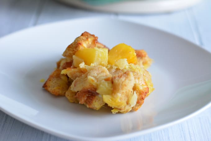  A spoonful of Lighter Pineapple Bread Casserole on a white plate.