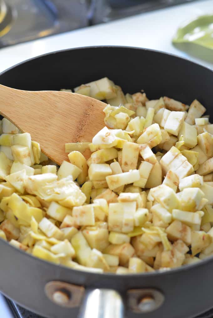 Diced eggplants in a saute pan.