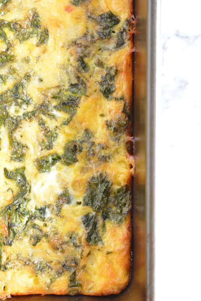 Kale and Cheddar Frittata without crust in a pan.