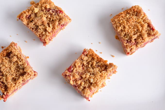 Strawberry Rhubarb Oat Crisp Bars cut into squares.