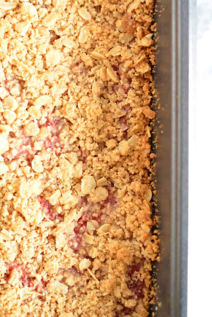 Strawberry Rhubarb Oat Crisp Bars in a baking pan.