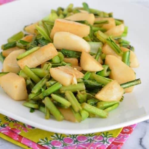 Cooked turnips on a white plate.