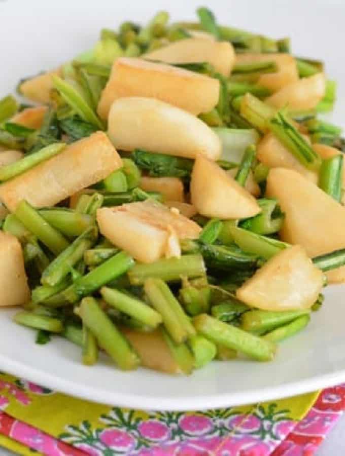 Cooked turnips on a white plate.