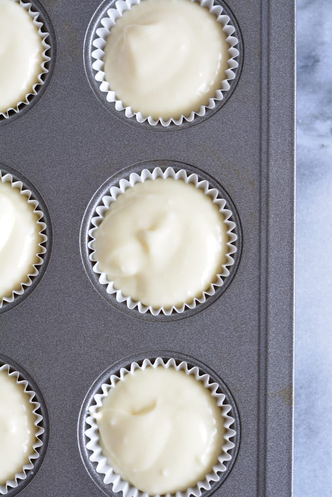 Cheesecake batter in a mini cupcake pan.