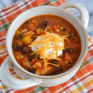 Leftover Turkey chili made with pumpkin puree, black beans, and butternut squash. A perfect way to use up leftover turkey.