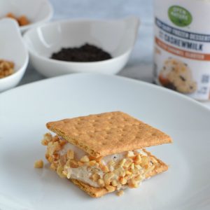 Low-calorie ice cream cookie sandwich on a white plate.