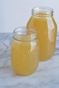 Homemade chicken broth in jars