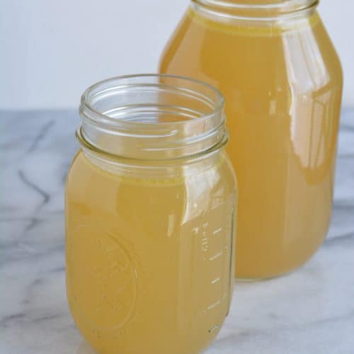 Homemade chicken broth in jars