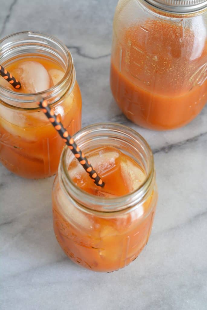 Pumpkin juice drink in a mason jar.