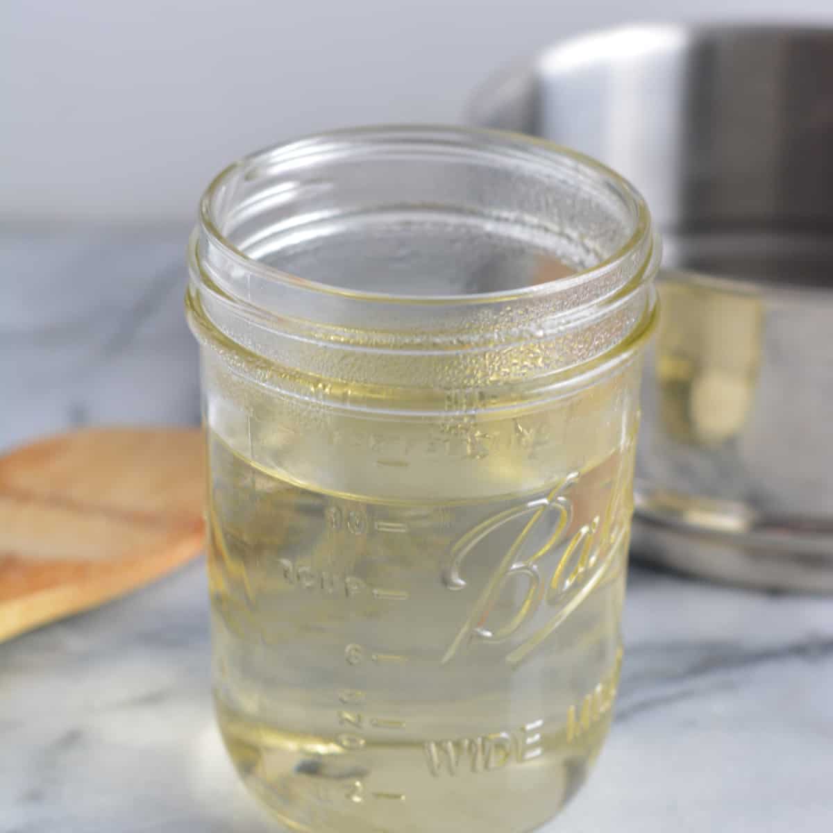 Simple syrup in a mason jar.